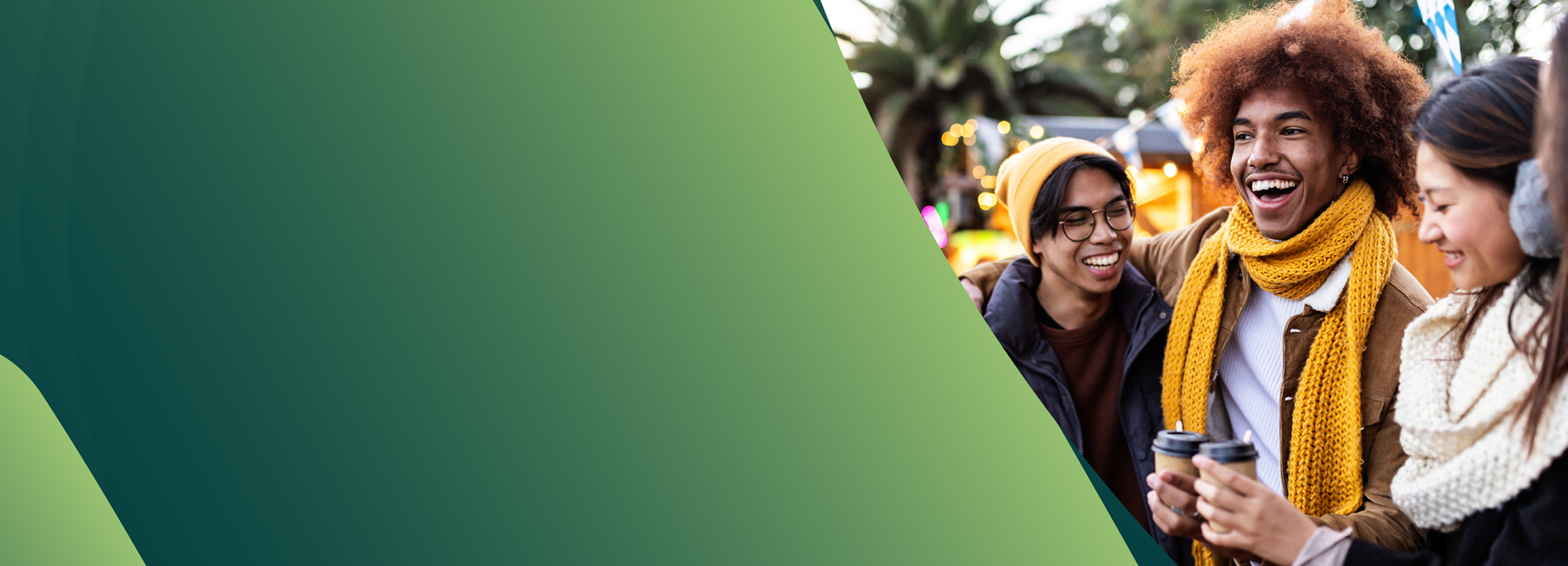 Person in winter clothing outdoors at night looking at a cellphone.