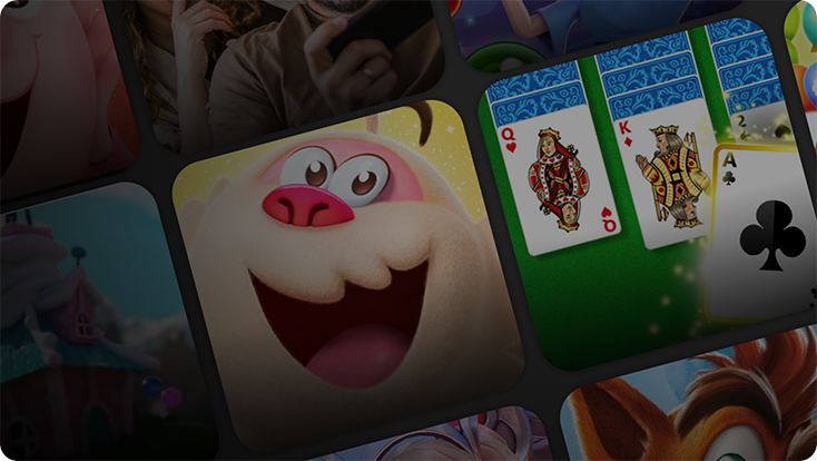 A close-up of game icons, including a smiling cartoon character and a solitaire card game with visible cards: Queen of Diamonds, King of Diamonds, and Ace of Clubs.