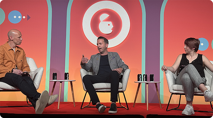 James Chandler (IAB), Chris Bailes, and Lisa Boyles (giffgaff) speak on stage at Advertising Week Europe