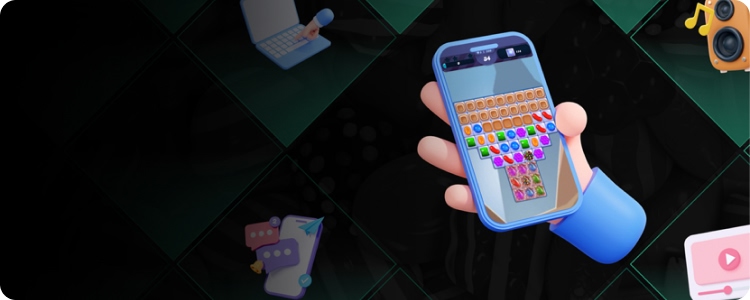Illustration of a hand holding a smartphone showing a match-three style mobile game